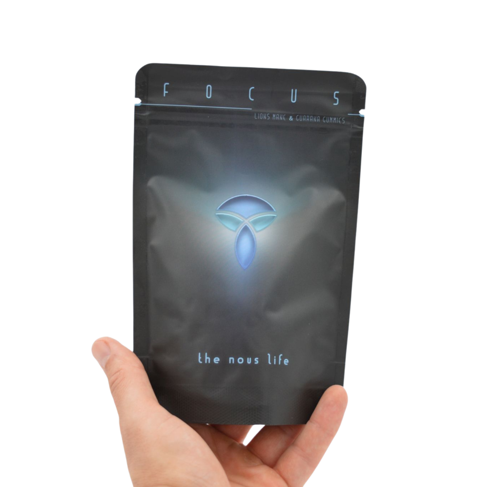 A person holding The Nous Life Lion’s Mane & Guarana Focus Gummies pouch, showcasing its compact size